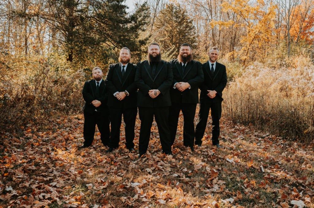 Moody Autumn Wedding men in black tuxes