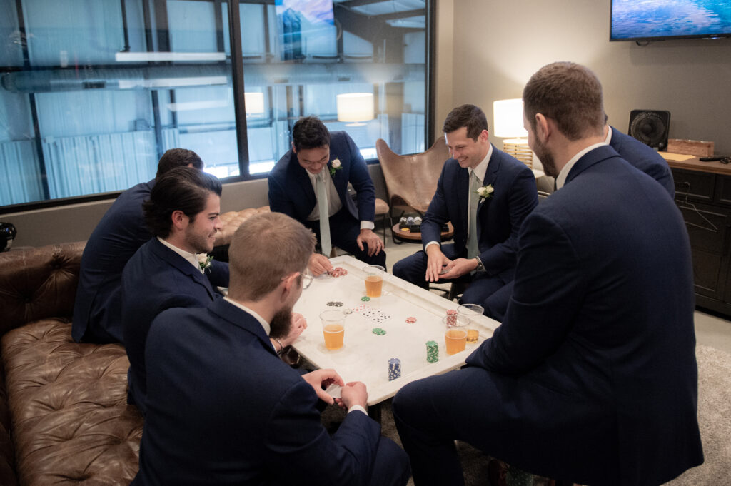 daniel's vineyard wedding - men playing poker in the groom's suite
