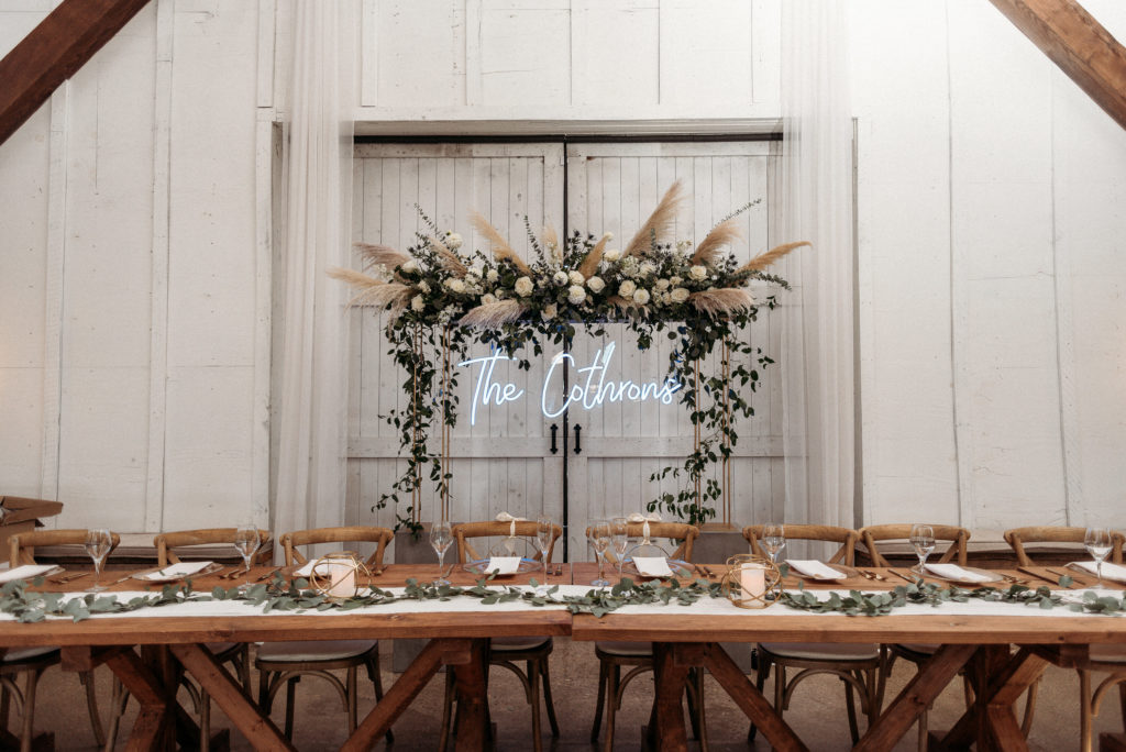 wedding at White Willow Farms - head table with neon sign
