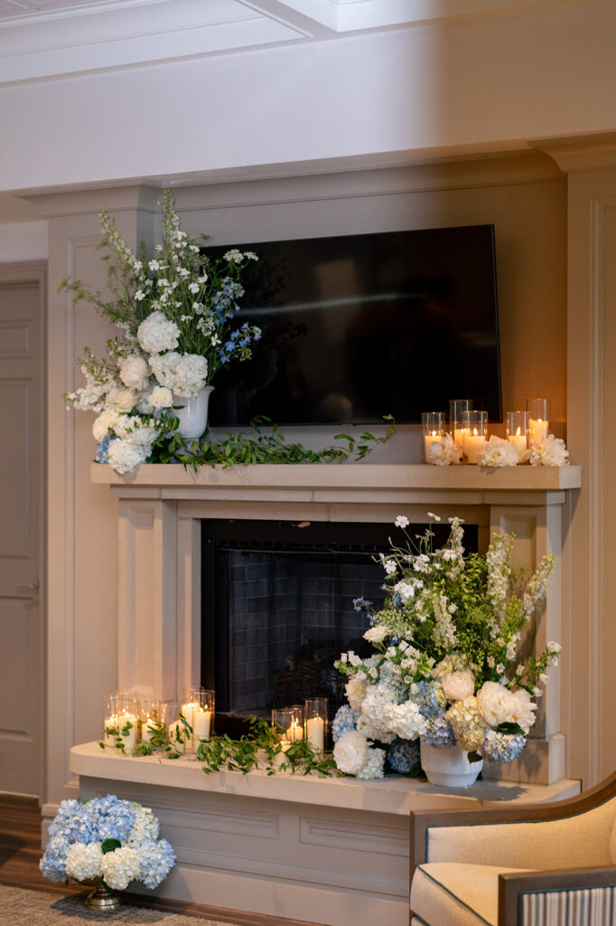 Holliday Farms clubhouse wedding with lobby mantle decorated in flowers