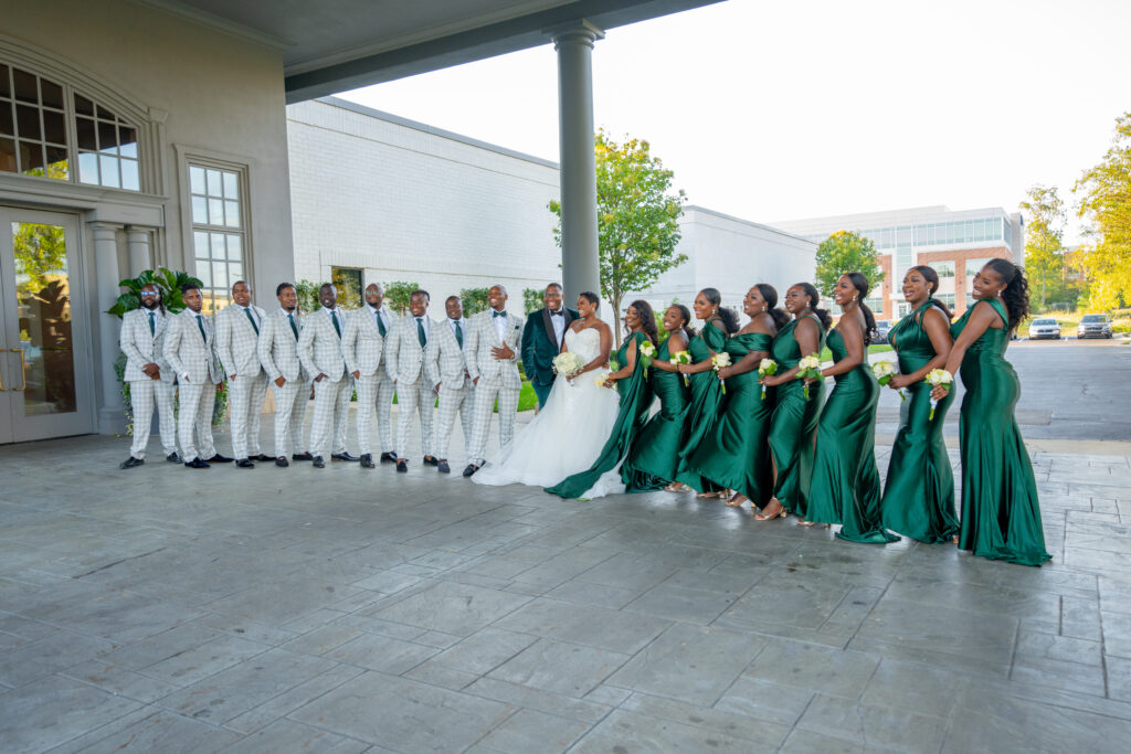 Zimbabwean Wedding with green bridesmaid dresses and plaid groomsmen suits
