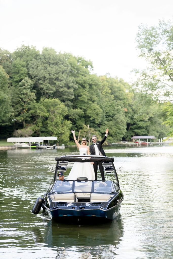 Morse Lake Wedding - Grand entrance on boat from marina