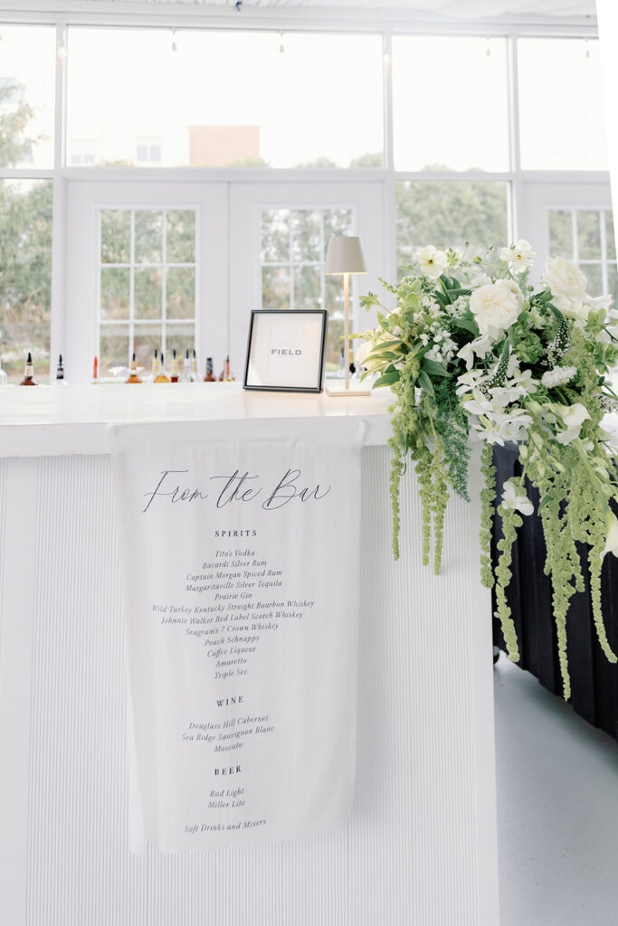 carmel wedding at ritz charles garden pavilion with fabric bar sign