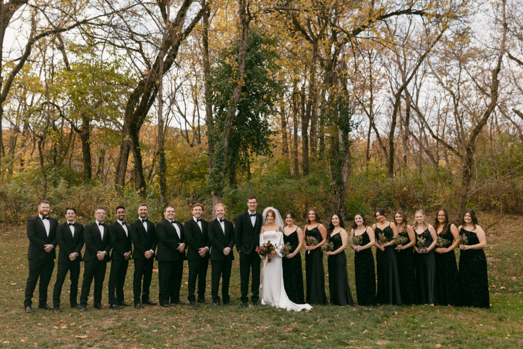 Fall wedding at the conservatory at evergreen with bridal party in all black